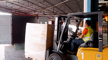 Forklift operator loading an LCL shipment